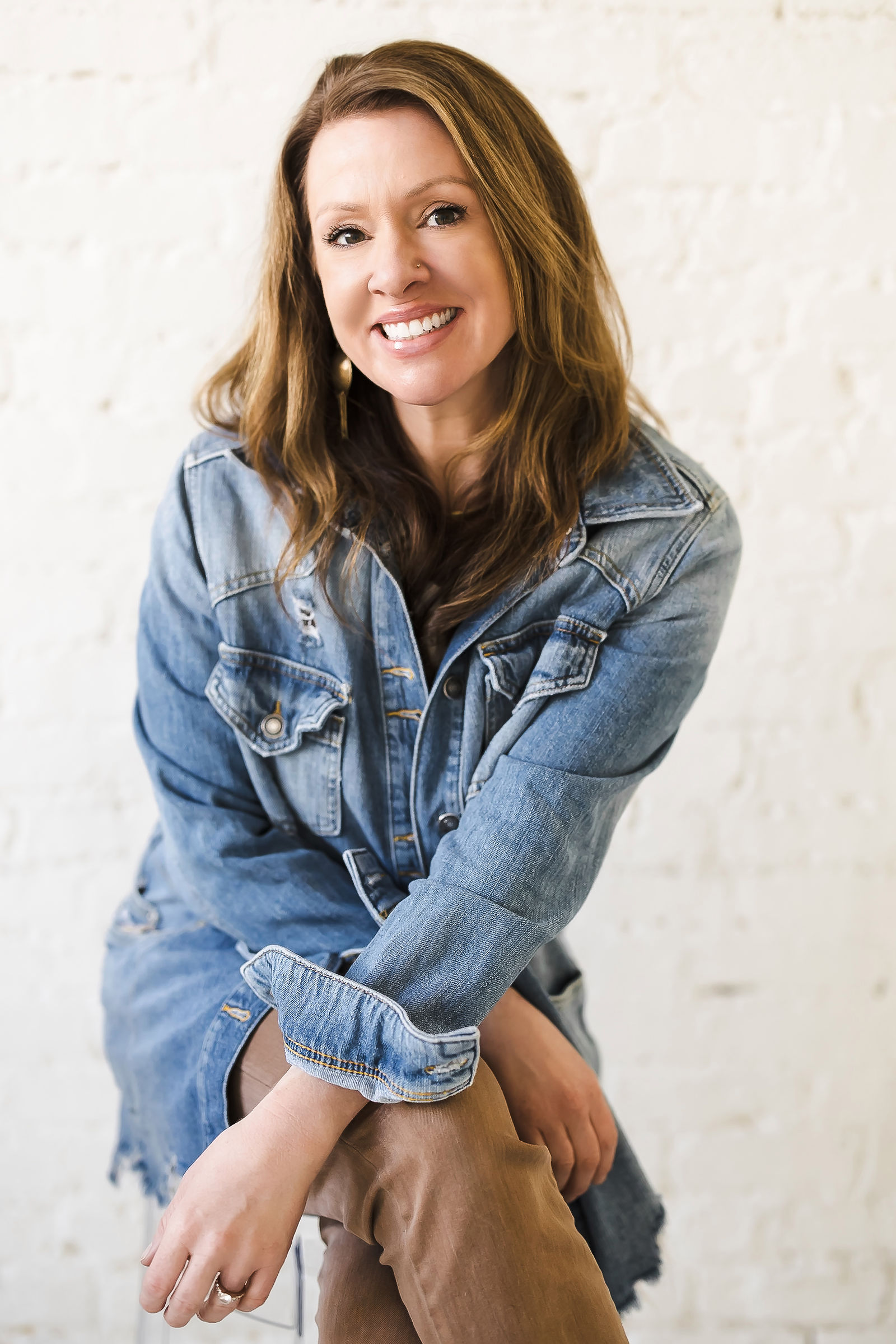 Katie Monroe, brand photographer, denim jacket, brick wall