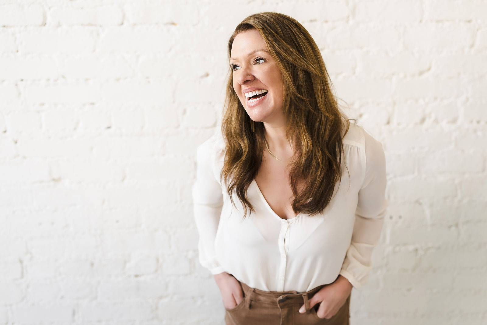 Katie Monroe, brand photographer, laughing