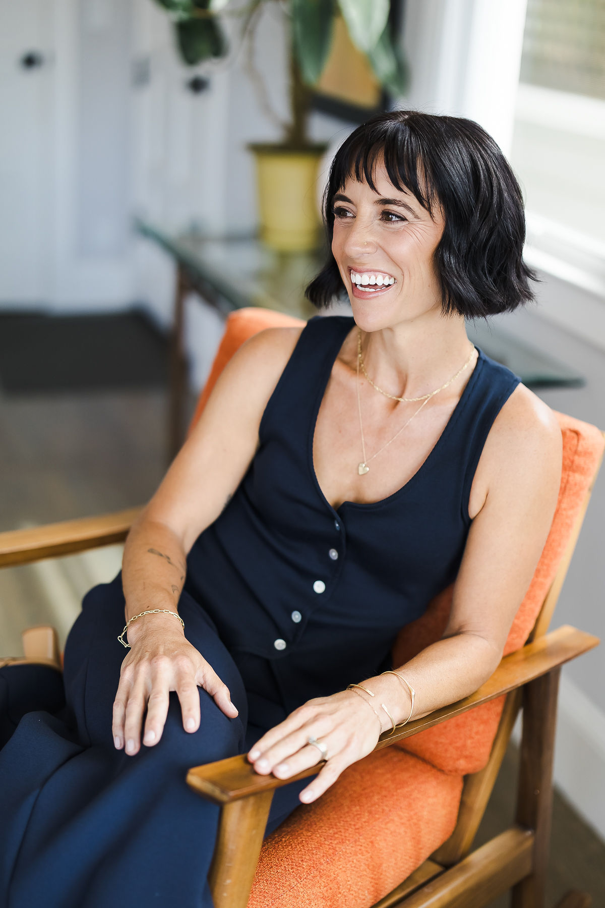 Founder brand portrait, orange chair