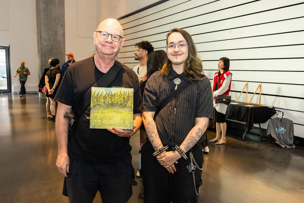 Two guests with a painting