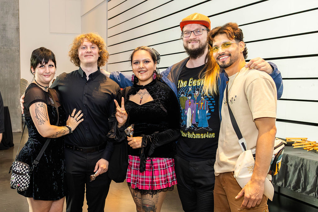 Friends smiling together at the art show