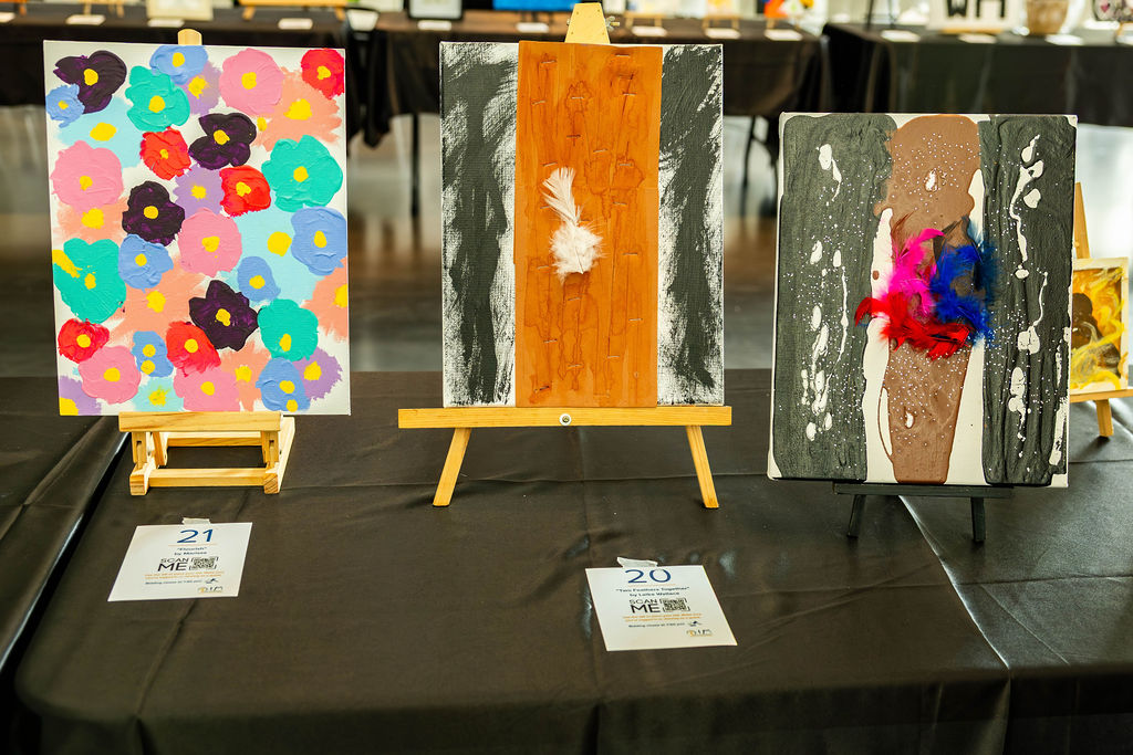 Colourful paintings on easels