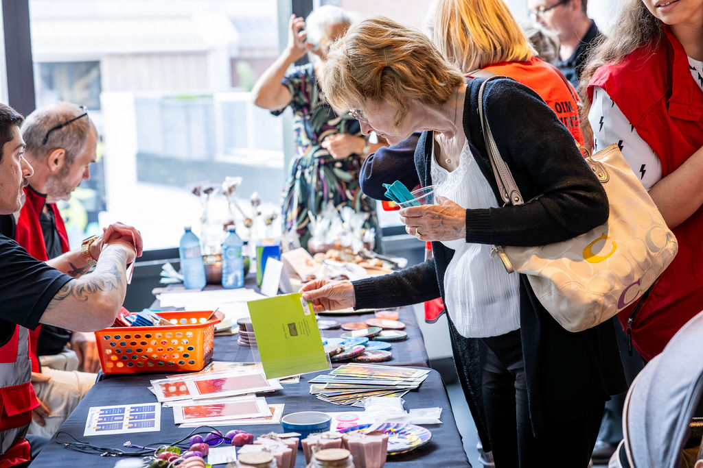 Guests browsing the art table