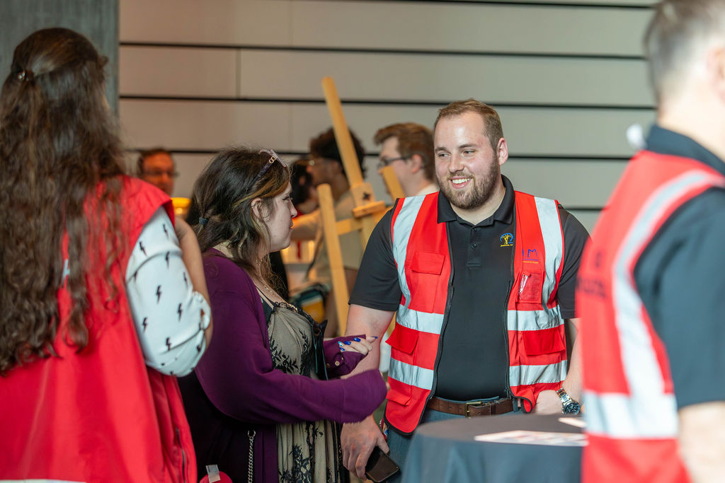 A volunteer chatting with a guest