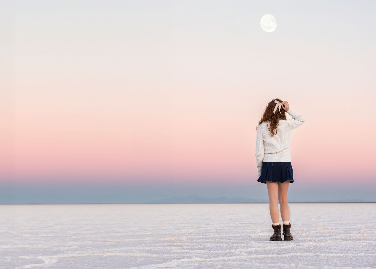 Senior portrait session at Salt Flats featuring dramatic horizon and clean styling