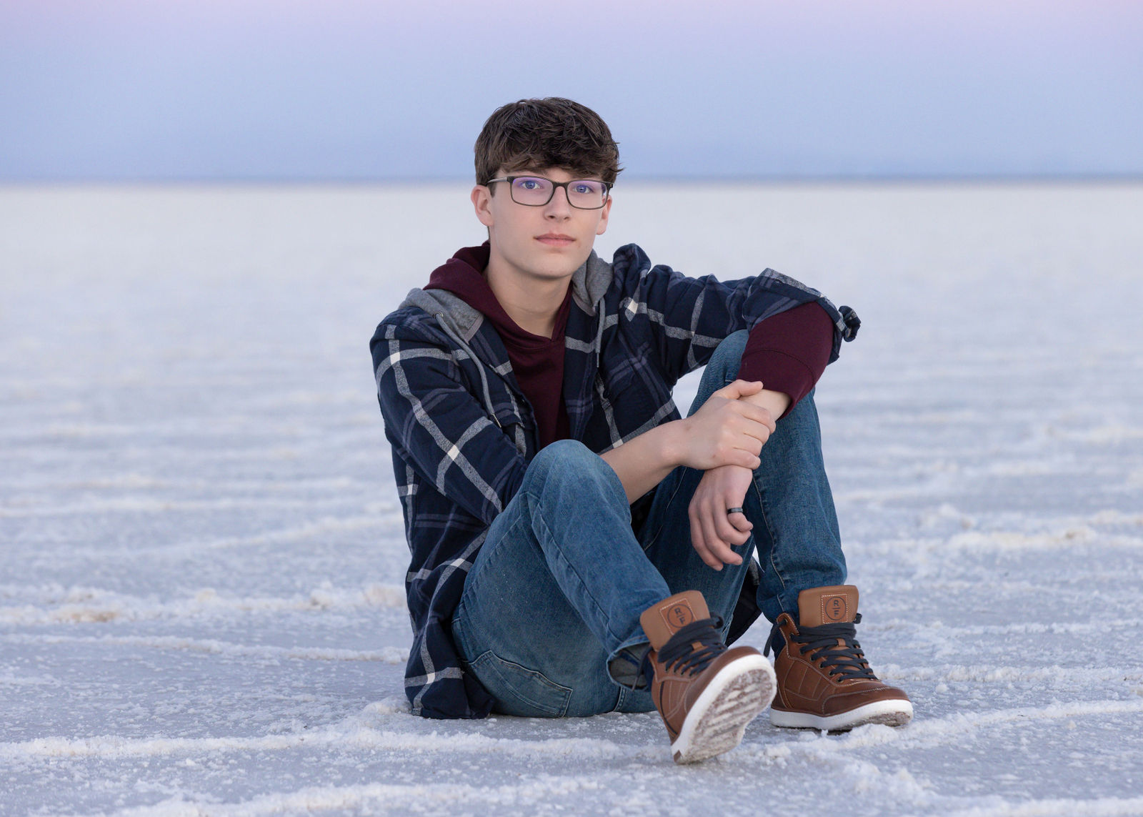 Nathan senior photos in Utah at the Bonneville Salt Flats with sunset tones