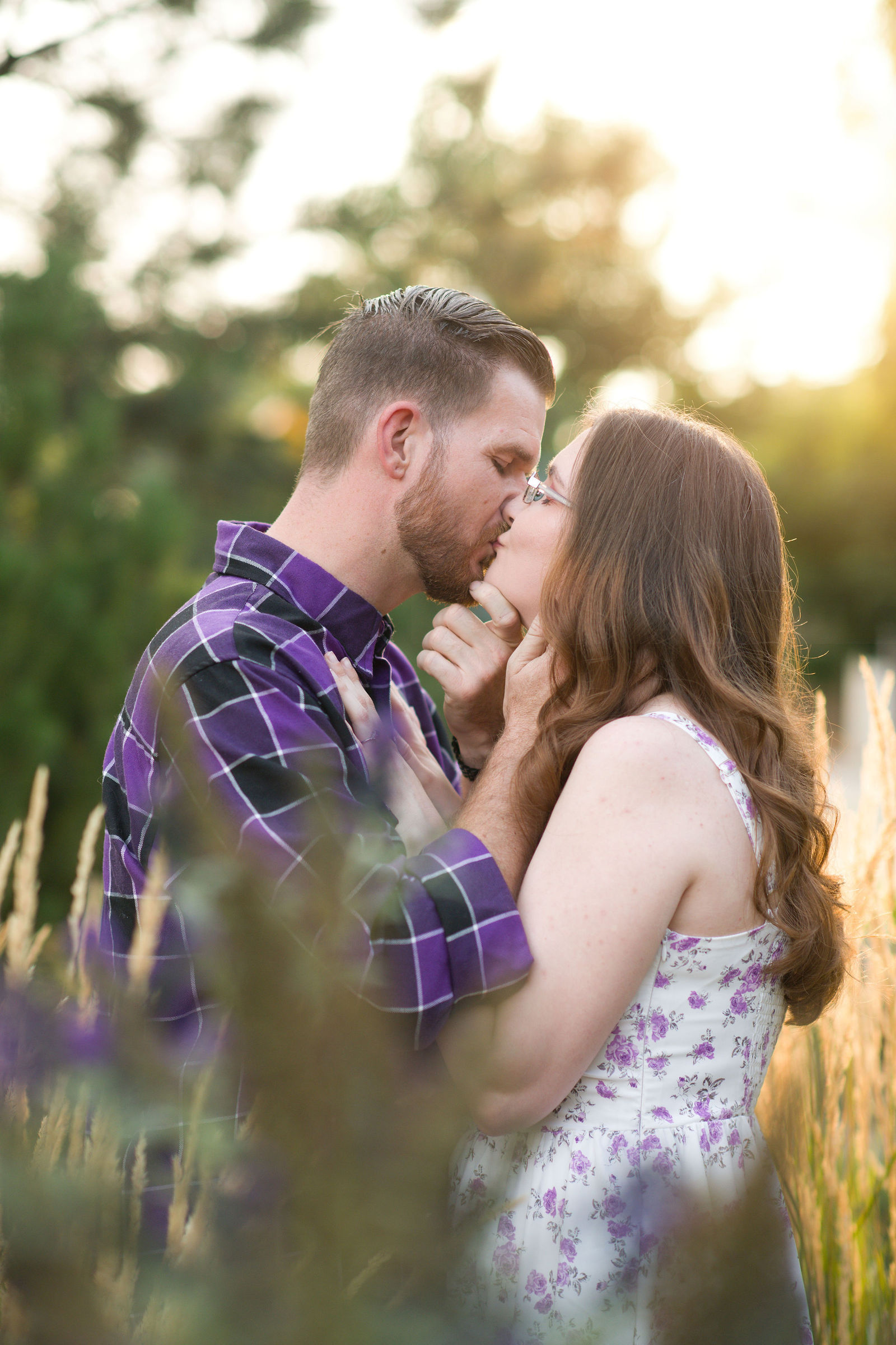 Couple sharing a kiss in golden evening light