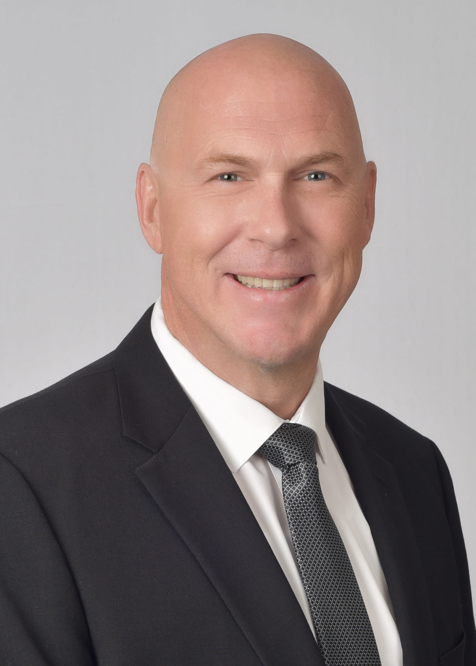 Executive headshot in suit and tie