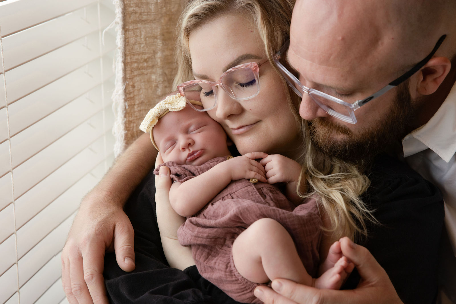 Utah County in-home newborn photographer capturing a softly posed newborn portrait on a neutral setup
