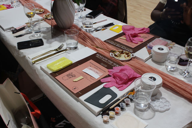 Textured art materials and table setting at Beneath the Surface