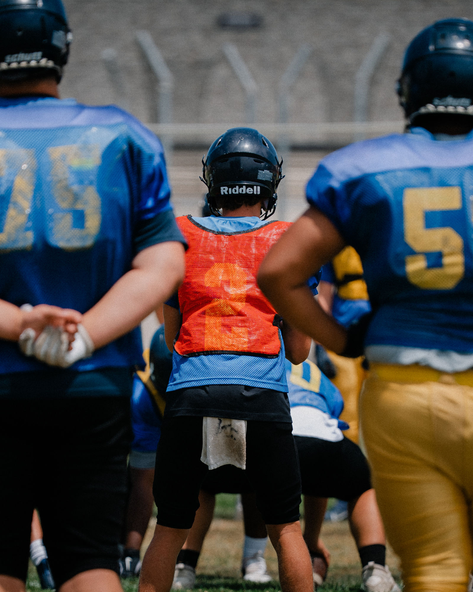 Arroyo Grande football coach and players between reps