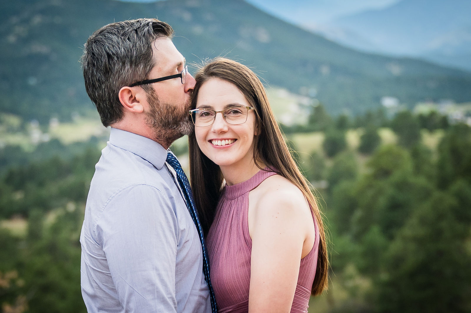 Engaged couple on a mountain overlook in Colorado at the end of the day