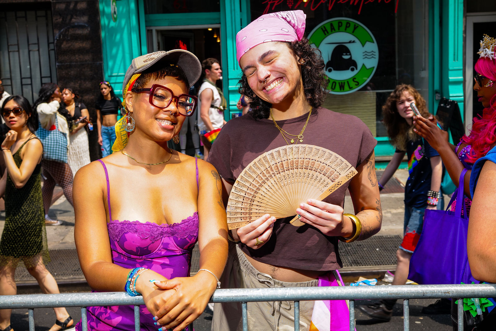 Two women laughing at the barricade — NYC Pride 2026