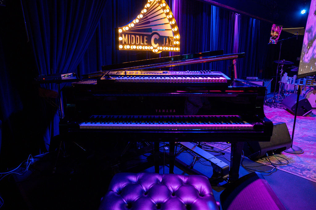 Middle C Jazz piano and illuminated venue sign