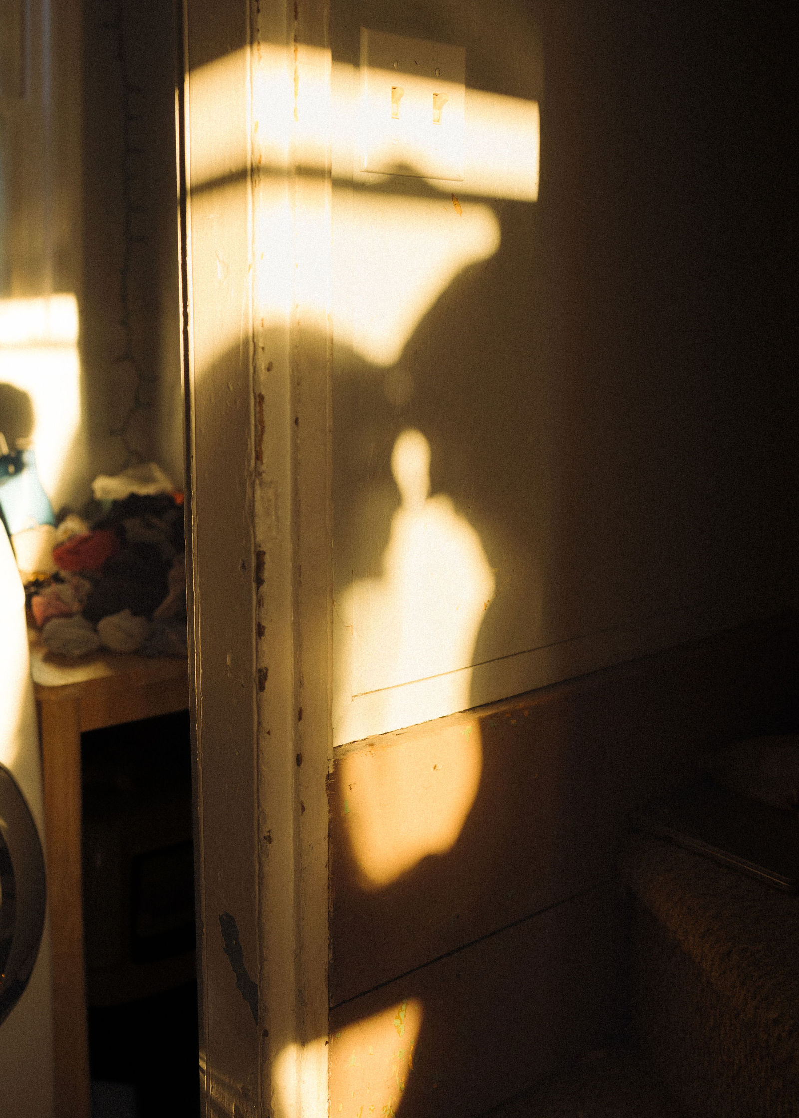 A silhouette of a couple inside their home
