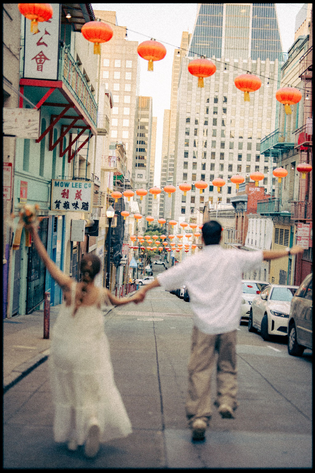 Movement beneath the lanterns