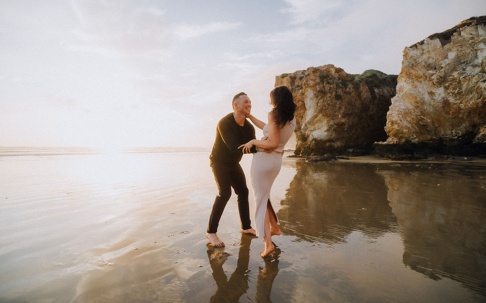 Barefoot laughter by the water
