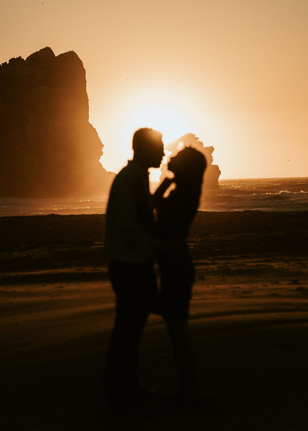 Two silhouettes at the shore