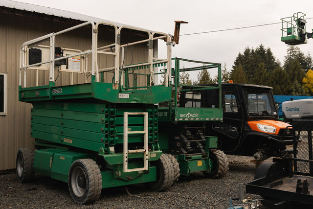Green scissor lift at Daily Machinery