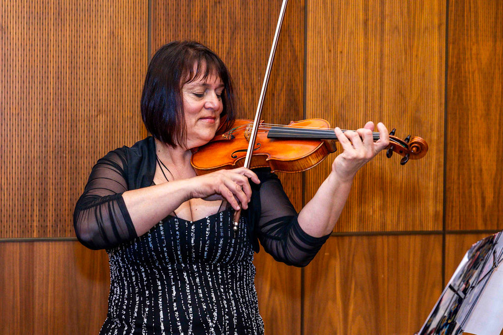 A violinist playing at the reception