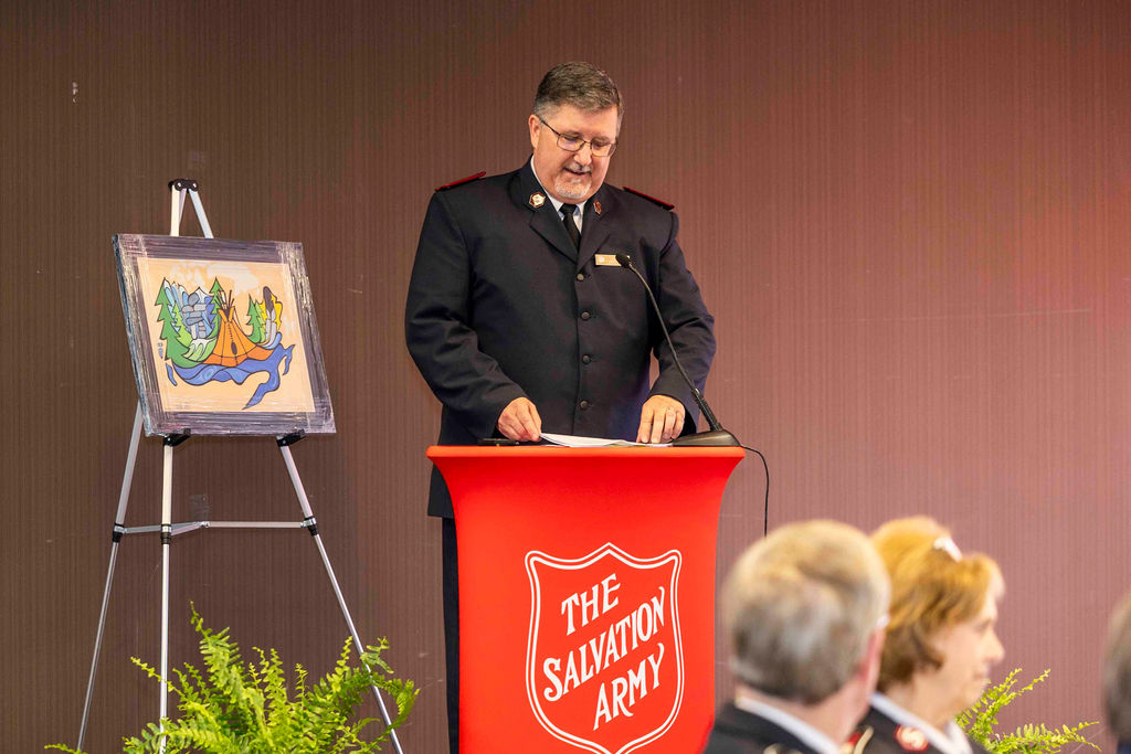 A speaker at the red kettle podium