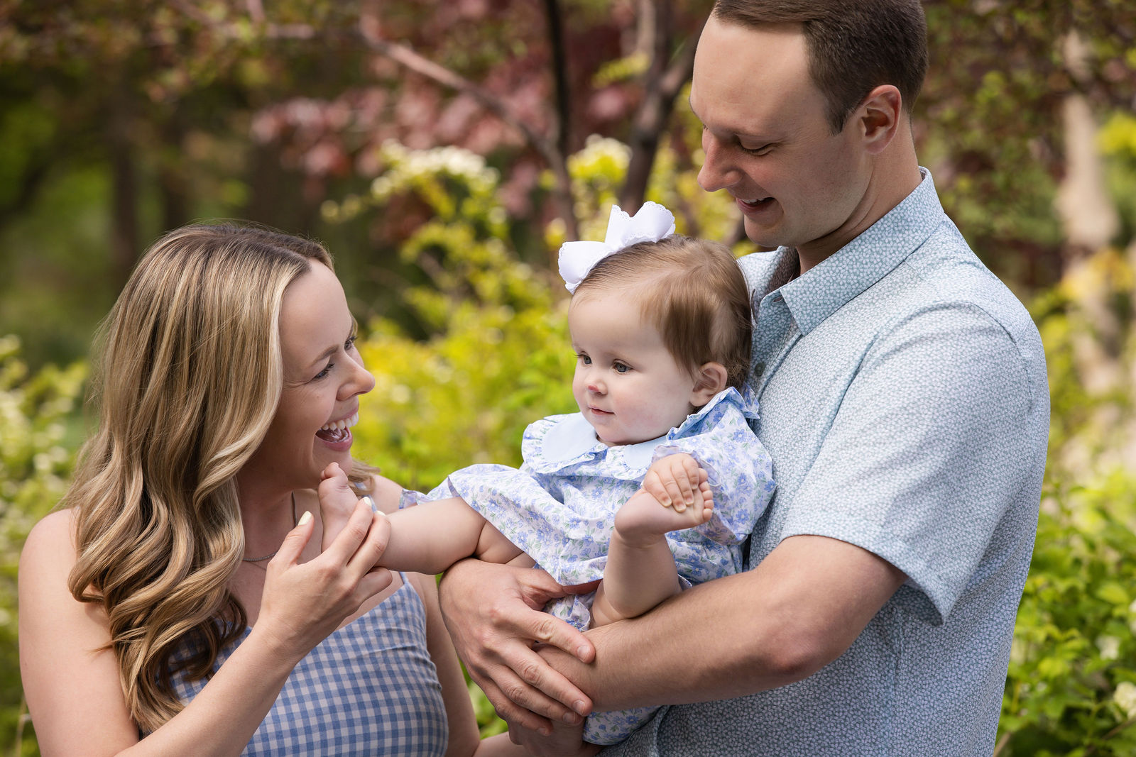 Family walking through Ashton Gardens during spring mini photos