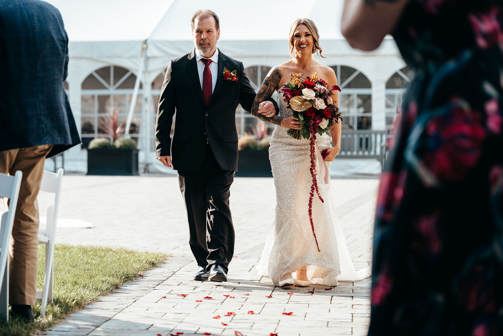 Kristin walking down the aisle with her father