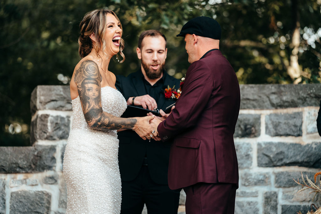 Kristin and Mike laughing together during their ceremony
