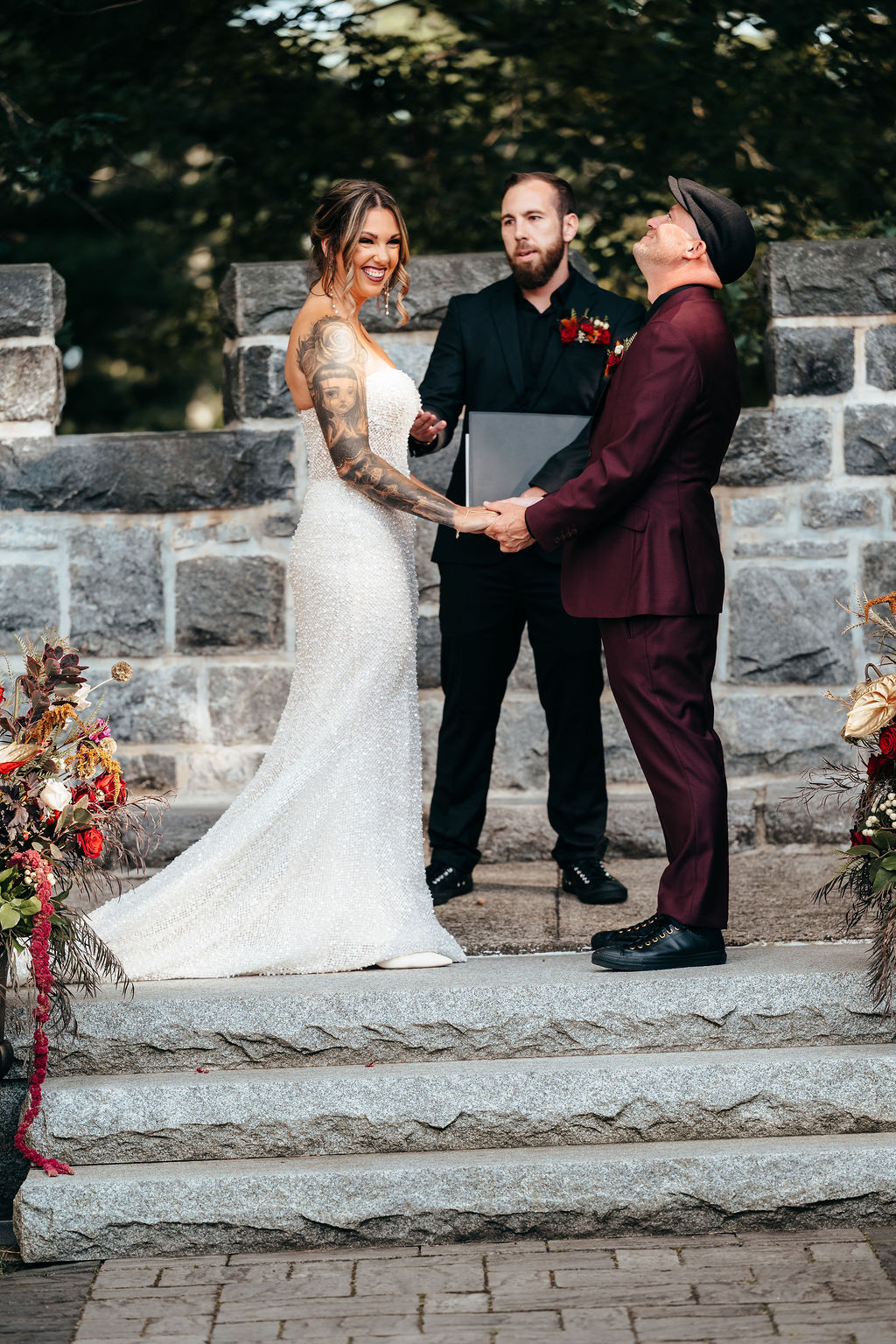 Kristin and Mike holding hands at the stone altar