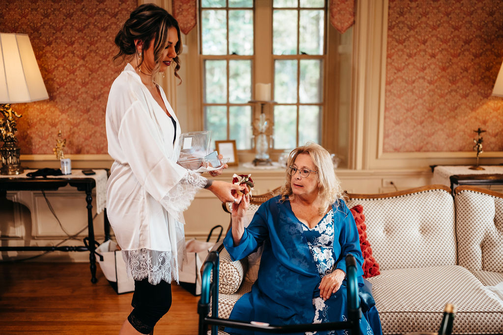 Kristin in her robe sharing a quiet moment with her mom while getting ready