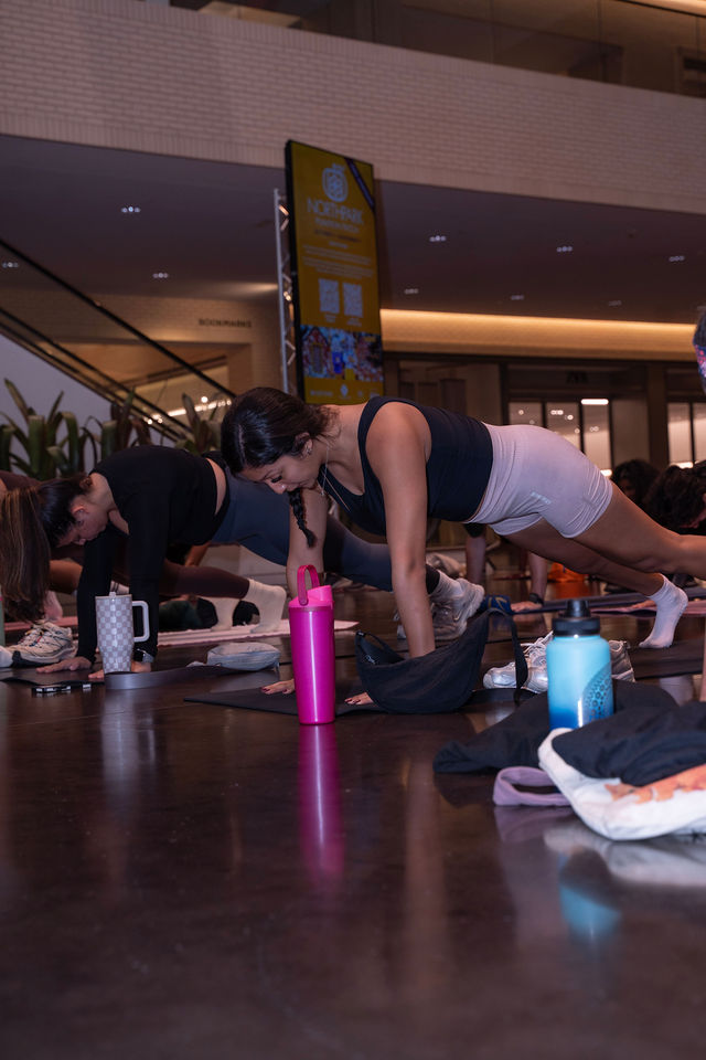 Athletes moving together on mats at Rise and Sculpt