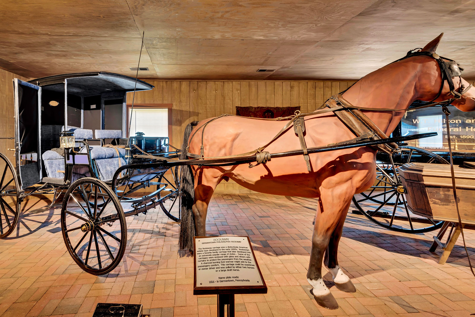 Carriage museum exhibit with horse and carriage