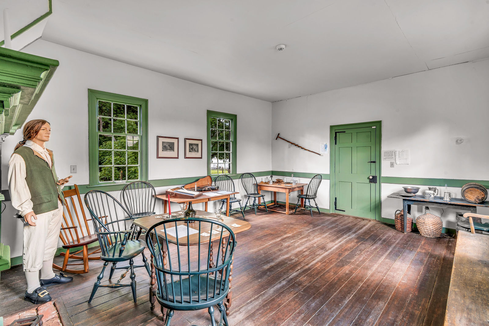 Historic tavern room with a costumed interpreter