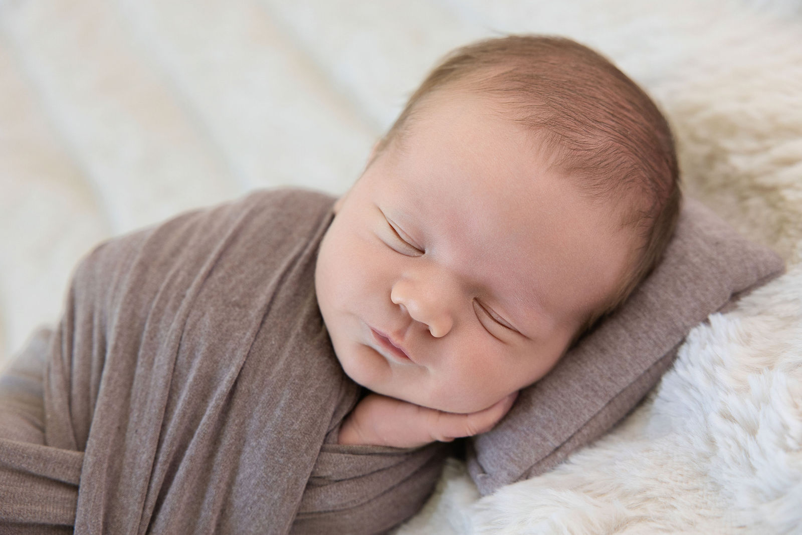 Newborn photographed in the studio for a Davis County family