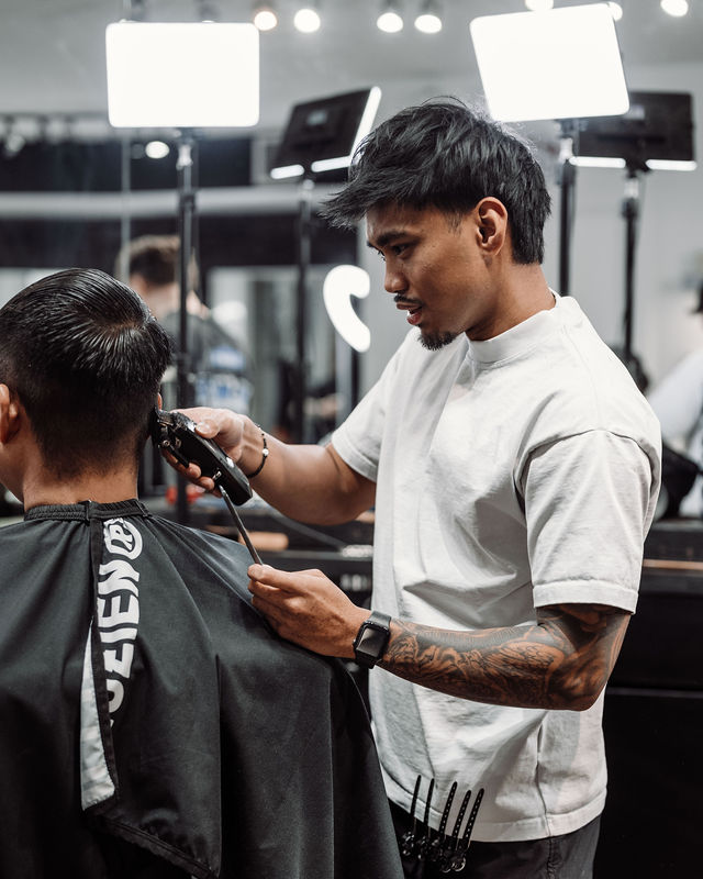 Professional barber cutting hair
