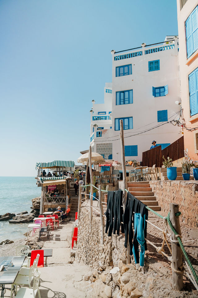 Taghazout seaside buildings and a walkway above the rocky shoreline