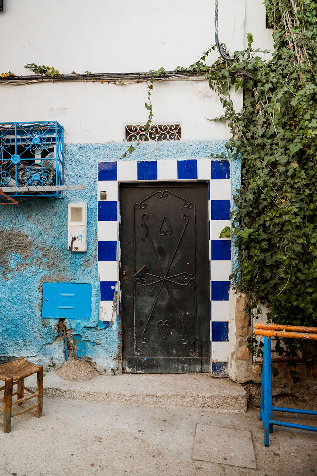 A doorway framed by blue and white tiles in Taghazout