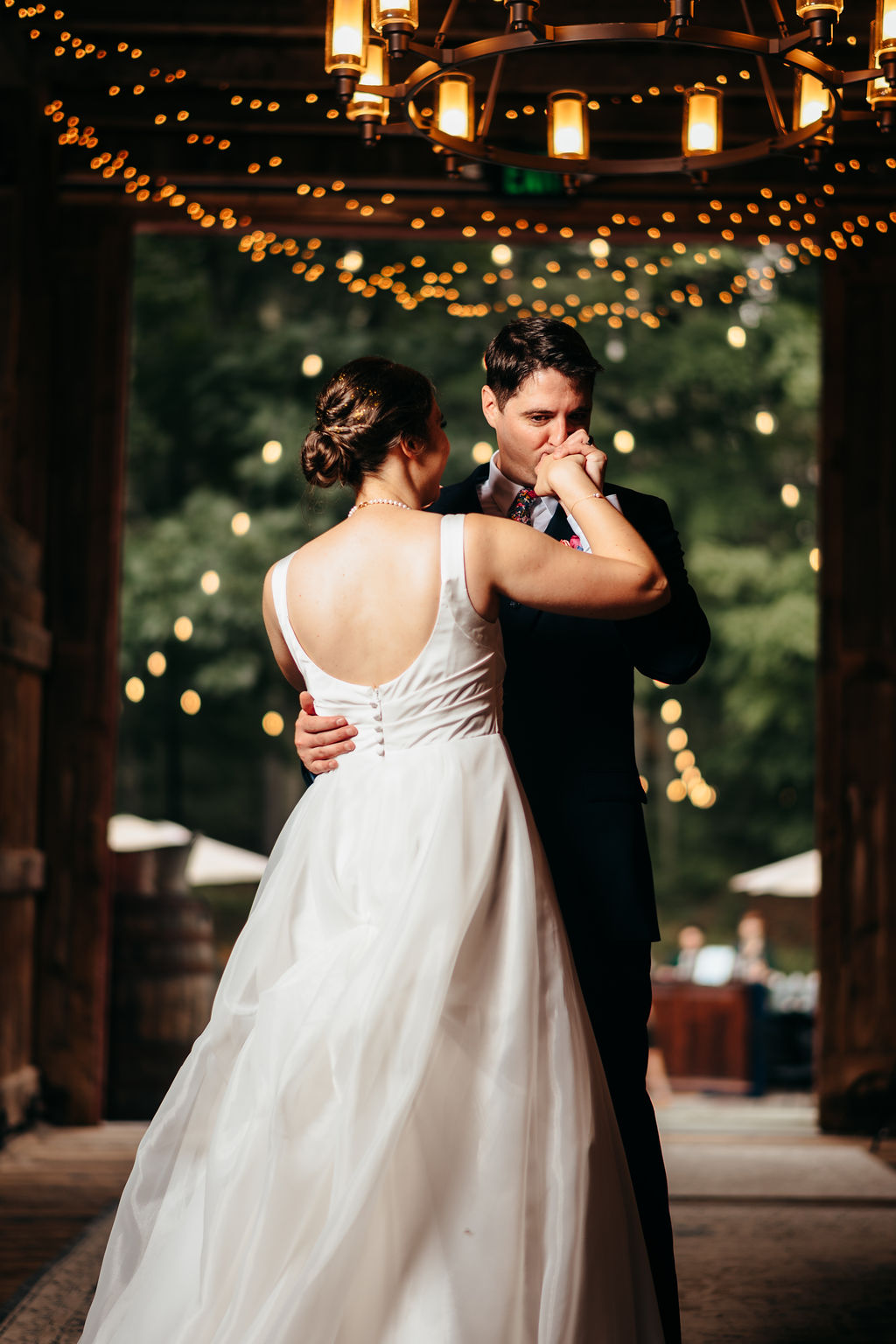 Couple sharing their first dance in the barn