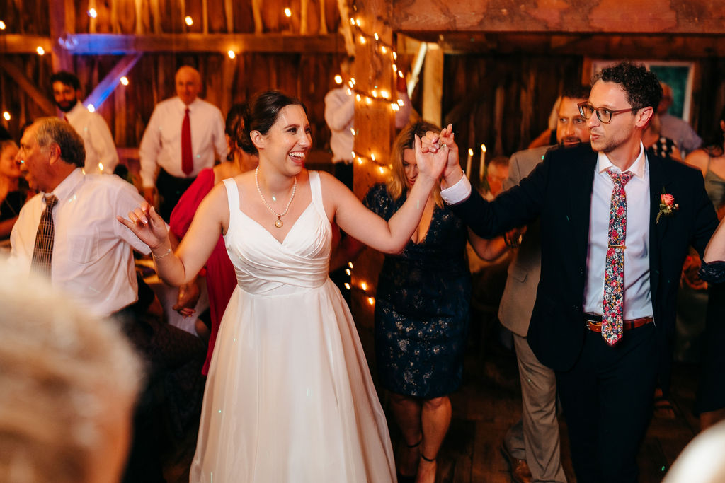 Bride dancing with guests on the dance floor