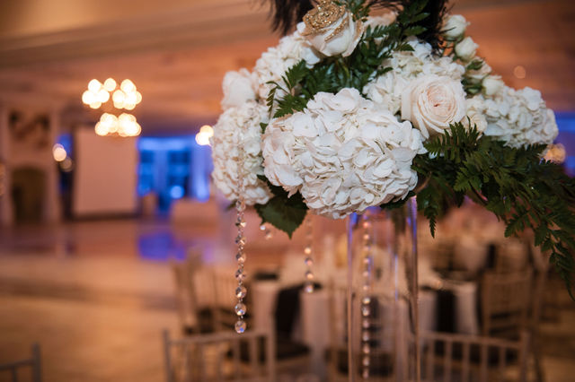 Elegant floral centerpiece with hanging crystals