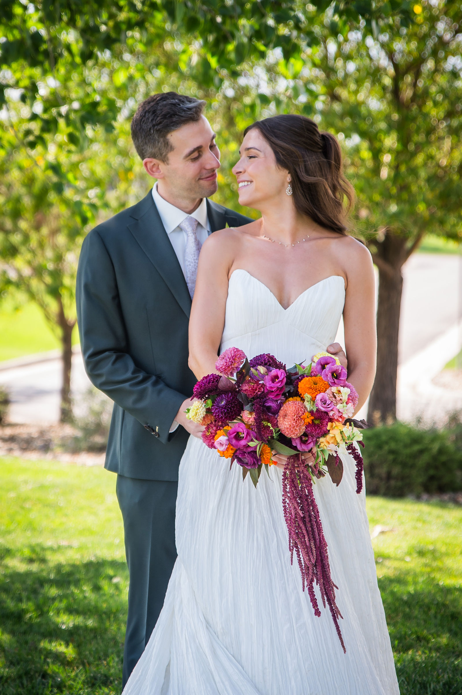 Bride holding a bold colorful bouquet at a Colorado wedding
