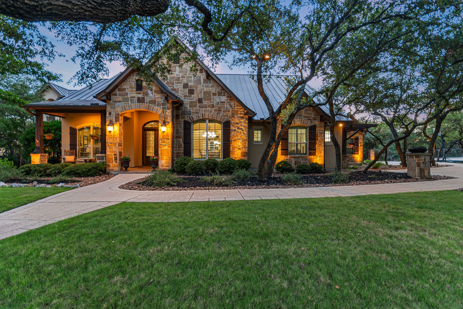 Heated pool, private cabana, and mature Live Oak trees at 25 Stone Terrace in Fair Oaks Ranch, Texas