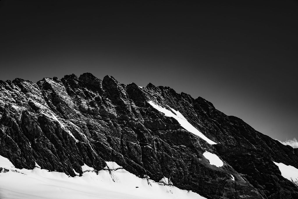 Snow-streaked rock ridge in black and white, Grindelwald