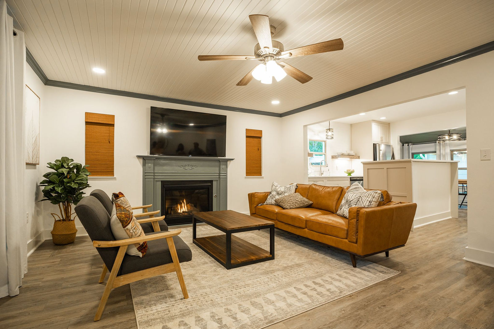 Warm remodeled living room completed by Fusion Master Builders
