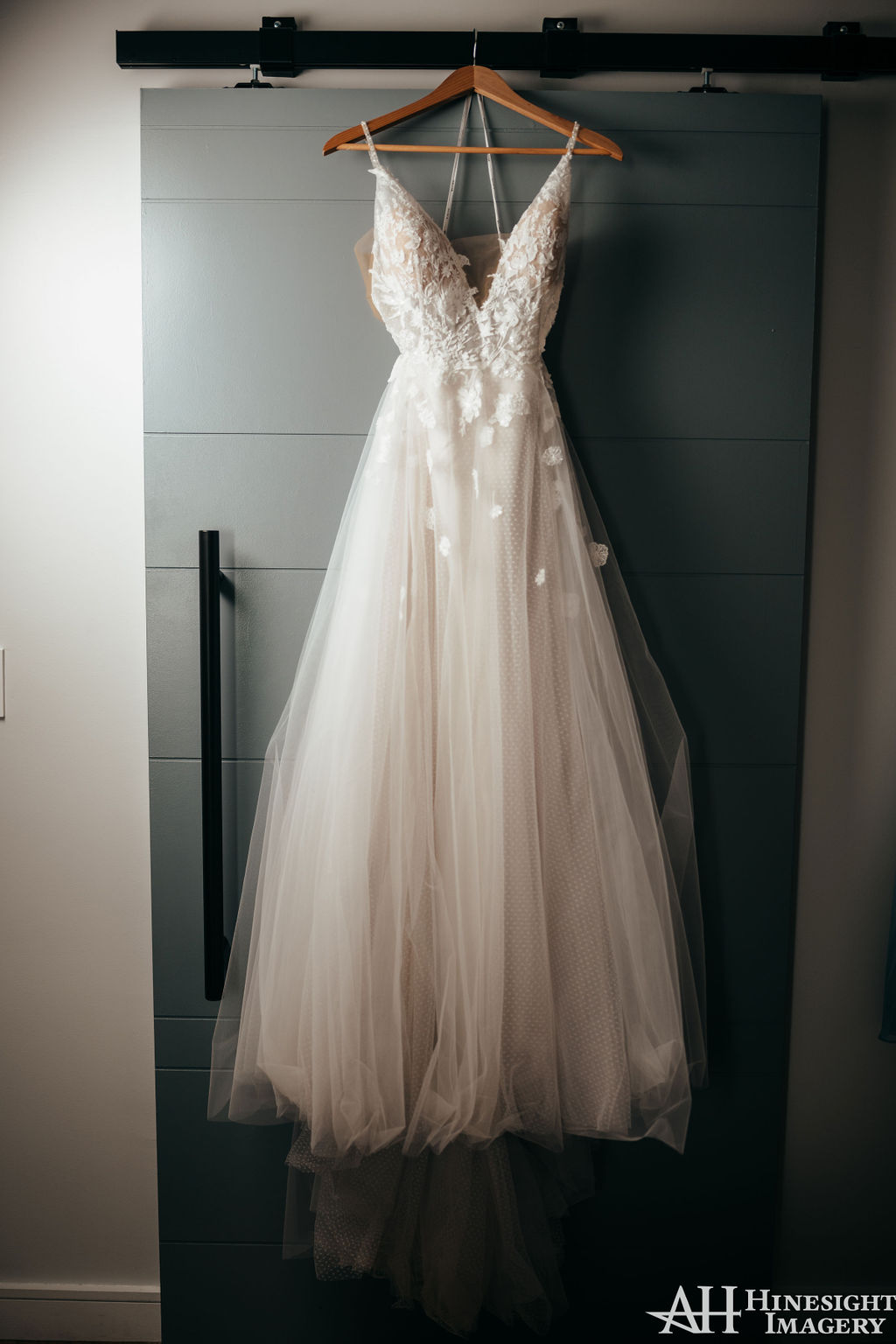 Wedding dress hanging on a door
