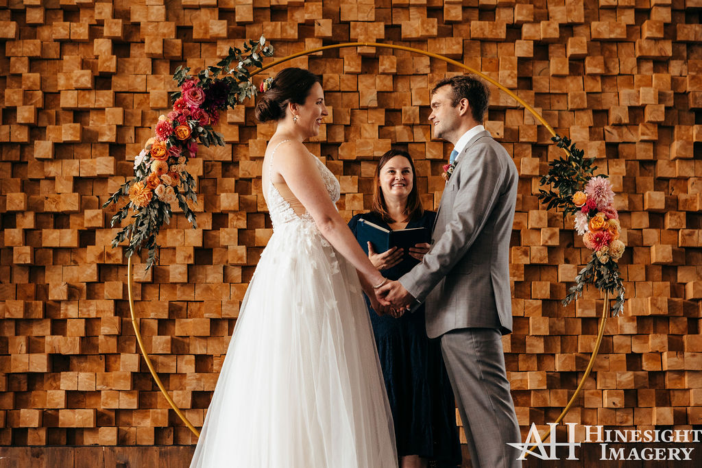 Couple holding hands at the altar