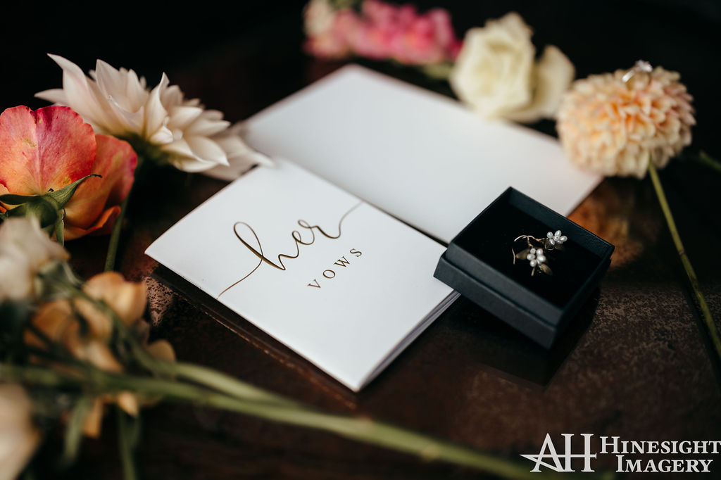 Bride's vow booklet with ring and flowers