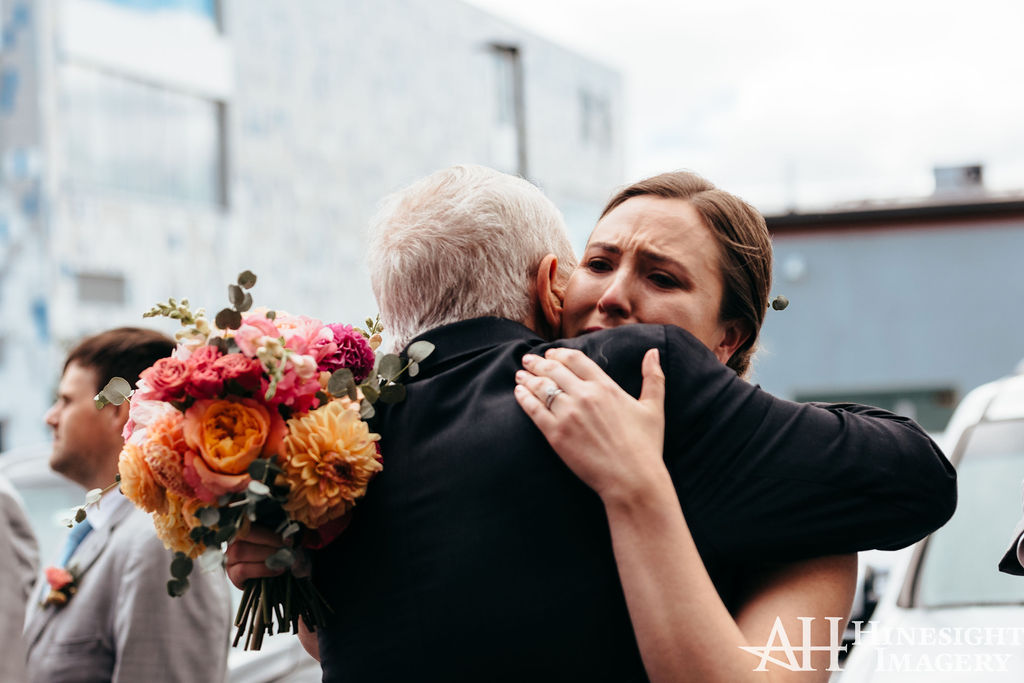 Emotional hug with bouquet