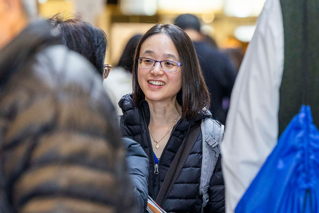 A guest smiling in the crowd