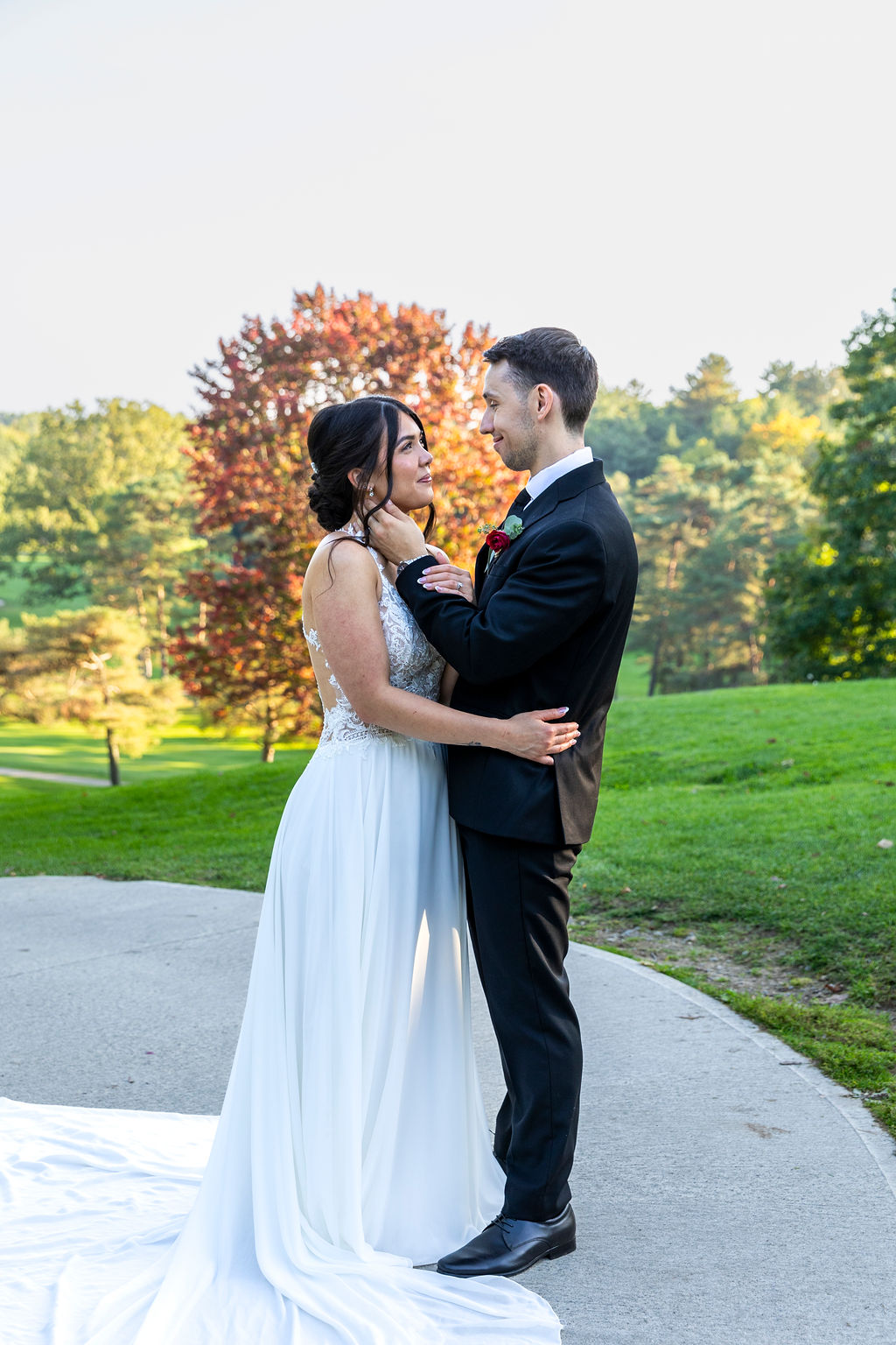 Brandon and Katherine beneath an autumn tree